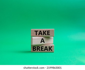 Take A Break Symbol. Concept Words 'Take A Break' On Wooden Blocks. Beautiful Green Background. Business And Take A Break Concept. Copy Space.