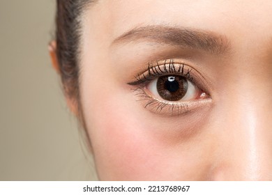 Take a close-up shot of the eyes of a woman wearing colored contact lenses. - Shutterstock ID 2213768967