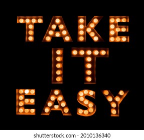 Take It Easy - Neon Inscription.  Signs. Style. Text. Neon Lights In A Store Front Window. A Sign That Is Easy For Customers To Take Notice.