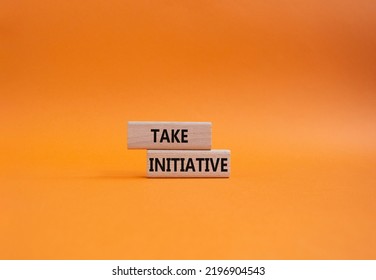 Take Initiative Symbol. Wooden Blocks With Words Take Initiative. Beautiful Orange Background. Business And Take Initiative Concept. Copy Space.