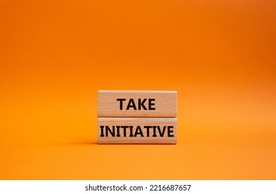 Take Initiative Symbol. Wooden Blocks With Words Take Initiative. Beautiful Orange Background. Business And Take Initiative Concept. Copy Space.