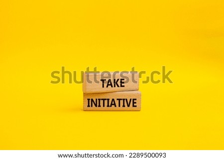 Take initiative symbol. Wooden blocks with words Take initiative. Beautiful yellow background. Business and Take initiative concept. Copy space.