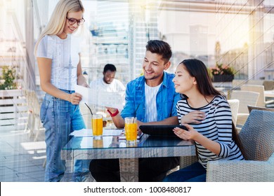 Take it. Amazing blonde bowing head while standing in semi position and talking to her friends - Shutterstock ID 1008480817