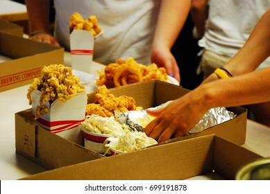 Take Out Restaurant Workers Scramble To Complete The Order Quickly And Accurately