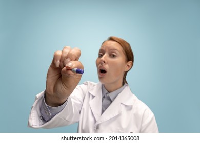 Take A Pill. Portrait Of Female Doctor, Therapeutic Or Medical Advisor At Work. Funny Meme Emotions. Concept Of Healthcare, Care Medicine And Humor. Copy Space For Ad, Design. Looks Excited