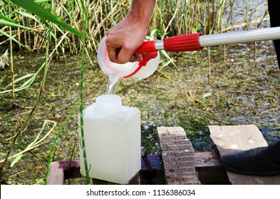 Take samples of water for laboratory testing. The concept - analysis of water purity, environment, ecology