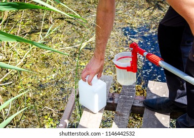 Take samples of water for laboratory testing. The concept - analysis of water purity, environment, ecology