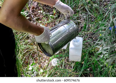 Take samples of water for laboratory testing. The concept - analysis of water purity, environment, ecology