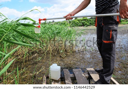 Take samples of water for laboratory testing. The concept - analysis of water purity, environment, ecology