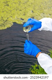 Take a water sample from the river. Selective focus. Nature.