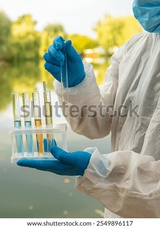 Take water samples for analysis. Selective focus. nature.