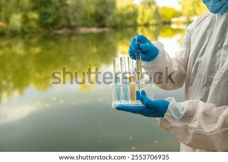 Take water samples for analysis. Selective focus. nature.