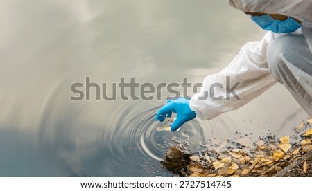 Take water samples for analysis. Selective focus. nature.