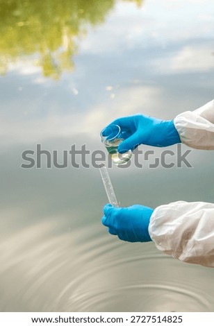 Take water samples for analysis. Selective focus. nature.