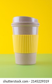 Takeaway Coffee Cup Close Up On Green And Yellow Background