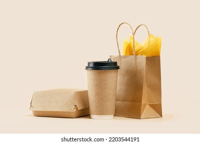 Takeaway Paper Coffee Cup With Lunch Bag And Burger Box On Beige. Snack Delivery Service. Coffee To Go. Grab And Go Or Carry Out Beverage. Disposable Mockup Packaging. Place For Text. Minimal