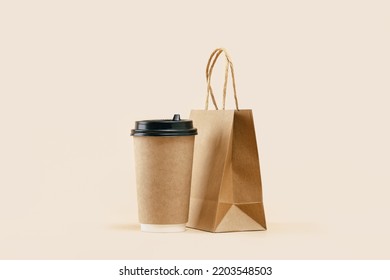 Takeaway Paper Coffee Cup With Lunch Bag On Beige. Snack Delivery Service. Coffee To Go. Grab And Go Or Carry Out Beverage. Disposable Mockup Packaging. Place For Text. Minimal