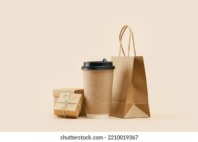 Takeaway Paper Coffee Cup With Lunch Bag And Bonus Gift Box On Beige. Snack Delivery Service. Coffee To Go. Grab And Go Or Carry Out Beverage. Disposable Mockup Packaging. Place For Text. Minimal