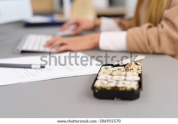 Takeaway Sushi Lunch On Office Table Royalty Free Stock Image