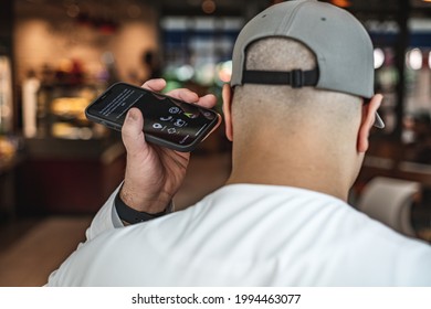 Taken at Dubai, United Arab Emirates on 29th of May 2021: Costa Coffee parters with RightHear - an app for the blind and visually impaired; Blind Arab man walking into the cafe while using the app.