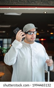 Taken at Dubai, United Arab Emirates on 29th of May 2021: Blind Arab man uses the RightHear app to help him locate his destination. RightHear is an app for the blind and visually impaired.