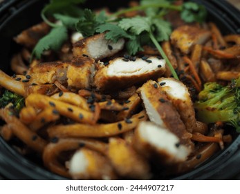 "Takeout bowl of stir-fried noodles with sliced chicken, vegetables, sesame seeds, and cilantro, fresh and ready to eat."