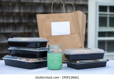 Takeout Boxes Piled Up With Brown Paper Bag And To-go Margarita Drink