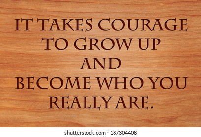 It Takes Courage To Grow Up And Become Who You Really Are - Quote By E.E. Cummings On Wooden Red Oak Background