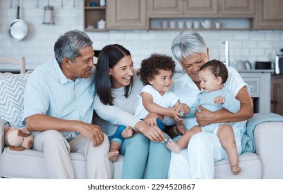 It takes a village. Shot of a beautiful family bonding on a sofa at home. - Powered by Shutterstock