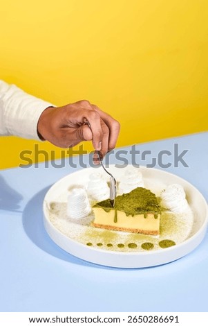 Taking a bite of matcha cheesecake