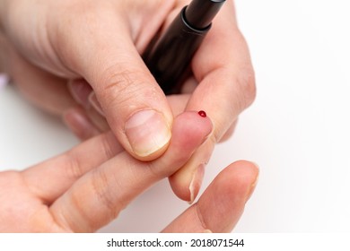 Taking Blood For Diabetes Sugar Level Medical Test From Finger