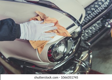 Taking Care Of Classic Car. Passionate Vintage Cars Collector Cleaning One Of His Vehicle. Closeup Photo.