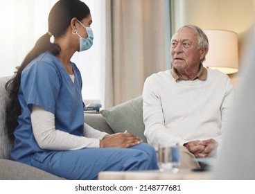 Taking Care Of You Is Her Passion. Shot Of A Young Female Nurse Having A Checkup With An Elderly Patient At Home.