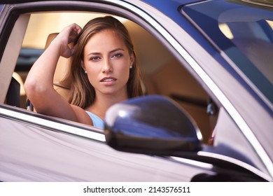 Taking Her Baby Out For A Spin. An Attractive Young Woman Out For A Drive In Her Sportscar.