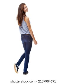 Taking a look back. Full-length studio shot of a beautiful young woman looking over her shoulder isolated on white.