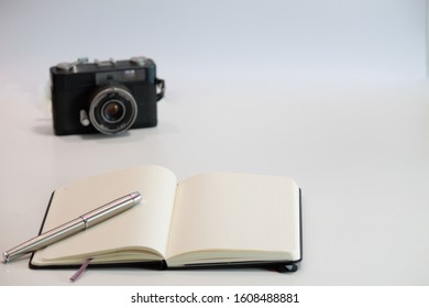 Taking notes. Notebook and pen.