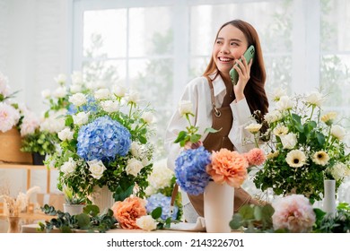 taking order florist working from home,young asian florist making list from client order to arrange flower bouqet vase delivery, Flower design store. happiness smiling young lady making flower vase  - Powered by Shutterstock