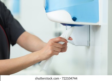 Taking Paper From Tissue Dispenser