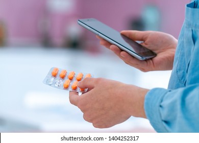 Taking pills, vitamins for treating diseases and wellness. Contraindications and prescription pills. Medicine woman reading online medication instructions. Doctor and online consultation - Powered by Shutterstock