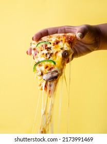 Taking Pizza Slice Up With Cheese Stretching   