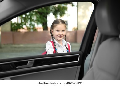 Taking Pupil After School. Girl Getting In Car