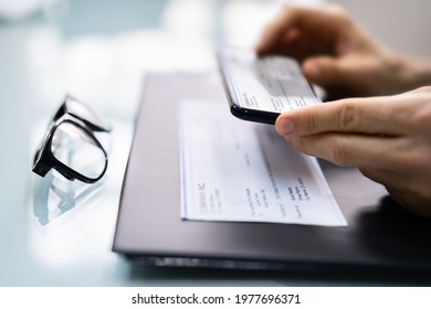 Taking Remote Deposit Payroll Cheque Document Picture