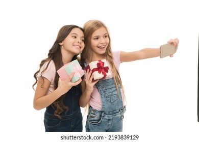 Taking Selfie. How Make Professional Unboxing. Girls Cute Kids Shooting Unboxing Video On Smartphone Camera. Video Call. Vlog Online Stream And Channel. Kid Hold Gift Box. Unboxing Birthday Gifts