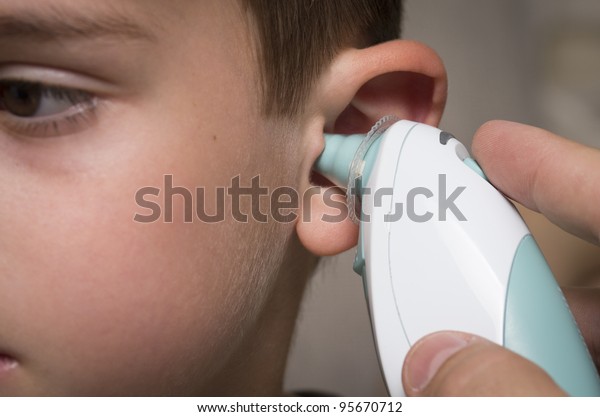 taking temperature in ear