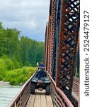 Taking the wheelers across the Talkeetna River in Talkeetna Alaska to a cabin deep in the woods