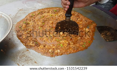 Takka Tak - Tawa Gurda Kapoora -Anarkali - Lahore Food Street, Pakistan. This is a typical Lahori dish. Zdjęcia stock © 