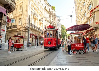 Taksim ISTANBUL, TURKEY – Agust  19, 2019 : Nostalgic Red Tram in Taksim Istiklal Street at evening. Taksim Istiklal Street is a popular destination in Istanbul. Beyoglu, Taksim, Istanbul. Turkey.
