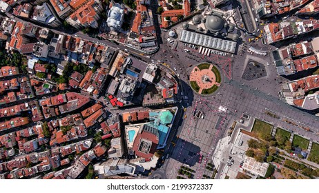 Taksim Square in Beyoglu district of Istanbul 6K bird's eye view of the French Consulate, Taksim Mosque, Gezi Park, Greek Church around Istiklal Street flying above central city center looking down