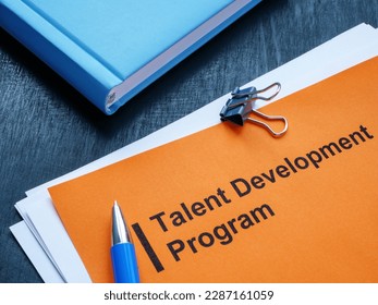 Talent development program, notepad and pen on the desk.