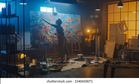 Talented Female Artist Works on Abstract Oil Painting, Using Paint Brush She Creates Modern Masterpiece. Dark and Messy Creative Studio where Large Canvas Stands on Easel Illuminated - Shutterstock ID 1540650071